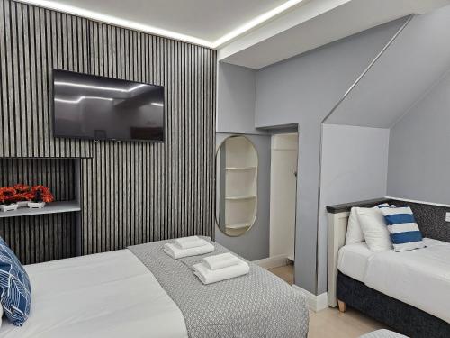 Habitación cuádruple del hotel London Stay Apartments. Foto 12