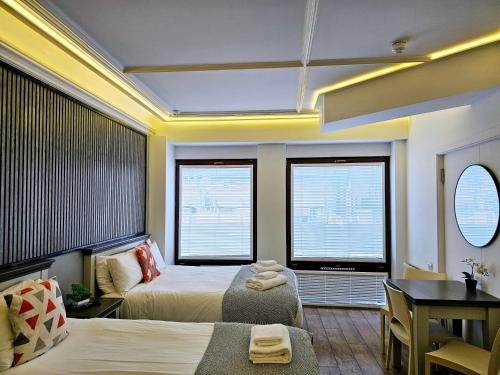 Habitación Triple del hotel London Stay Apartments. Foto 4