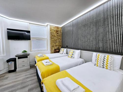 Habitación Triple del hotel London Stay Apartments. Foto 11