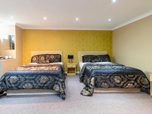 Habitación Cuádruple Estándar del hotel Stuart. Foto 1