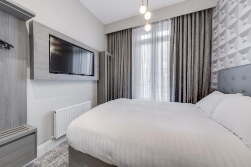 Habitación Doble Económica del hotel Mornington Victor London Belgravia. Foto 5