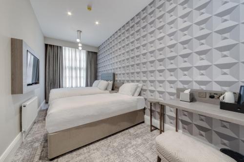 Habitación Familiar del hotel Mornington Victor London Belgravia. Foto 1