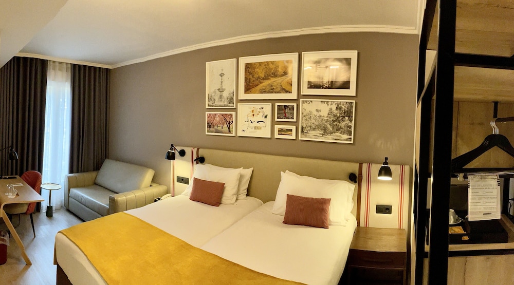 Habitación Premium, varias camas del hotel Indigo Madrid - Princesa, An Ihg