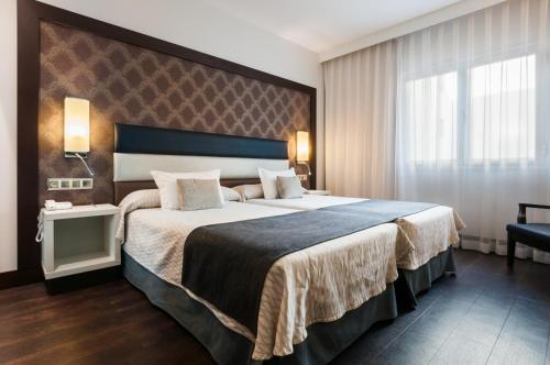 Habitación Doble Deluxe - 1 o 2 camas del hotel Gran Versalles. Foto 3