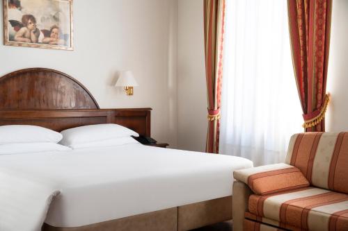 Habitación Cuádruple Clásica del hotel Boccaccio. Foto 1
