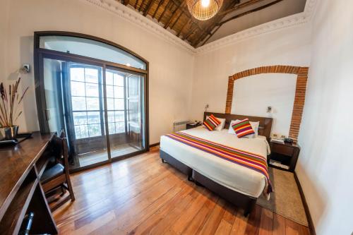 Habitación con cama extragrande. del hotel La Casona Boutique. Foto 1