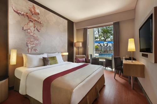 Suite Junior con 1 cama doble y Sofá del hotel Mercure Bali Nusa Dua. Foto 4