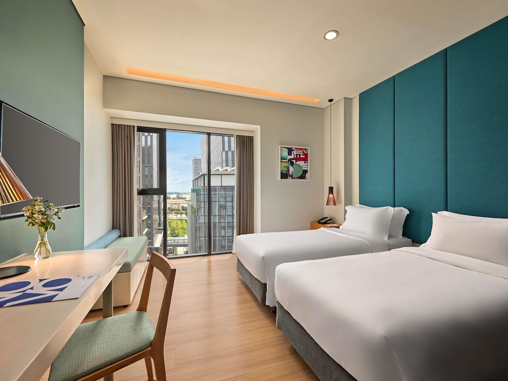 Estudio con 2 camas individuales del hotel Novotel Living Saigon South