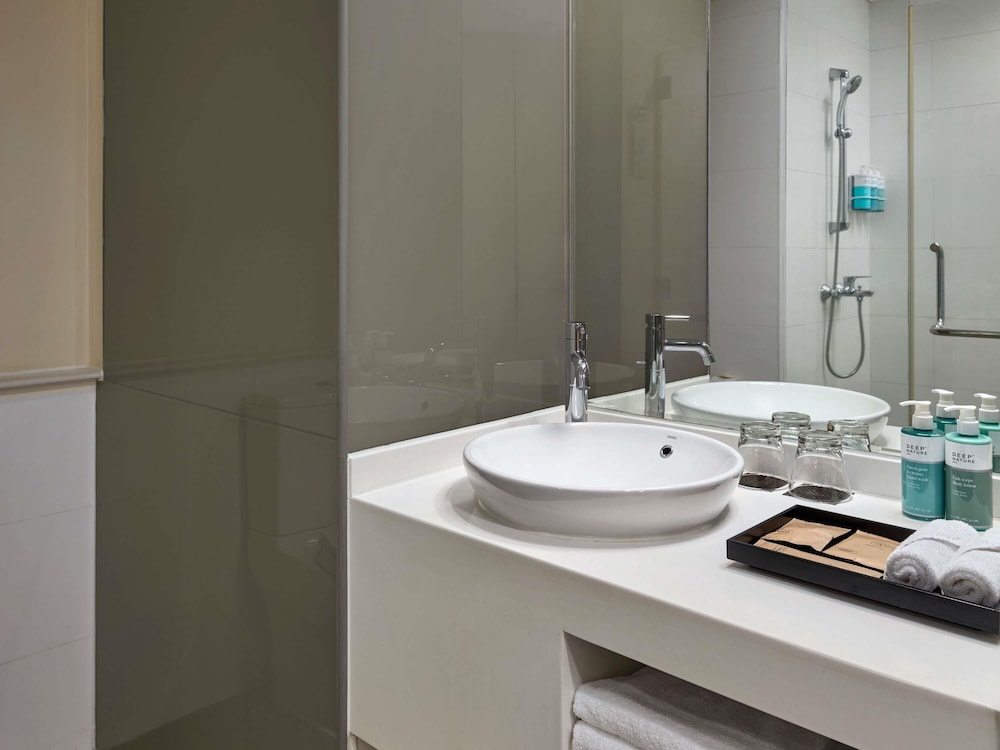 Estudio con 2 camas individuales del hotel Novotel Living Saigon South. Foto 3