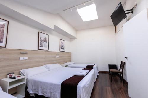 Habitación Cuádruple del hotel Gran Via. Foto 10