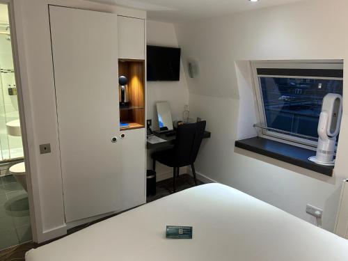 Habitación Doble Estándar del hotel The Wesley Euston. Foto 7