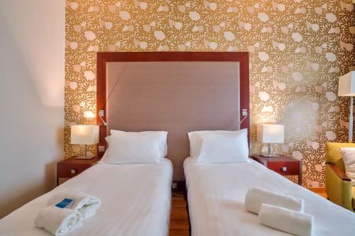 Estudio Doble con 2 camas individuales del hotel Clarion Paris CDG Airport. Foto 4