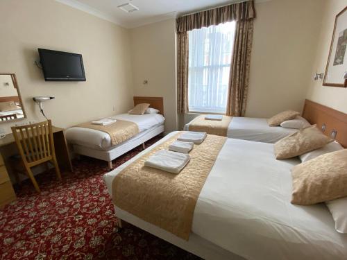 Habitación cuádruple del hotel Belvedere. Foto 4