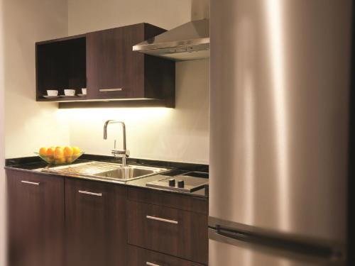 Habitación Doble Deluxe - 2 camas del hotel Movenpick Apartments Al Mamzar Dubai. Foto 1