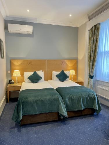 Habitación Doble Deluxe - 2 camas del hotel The Windermere , London. Foto 1