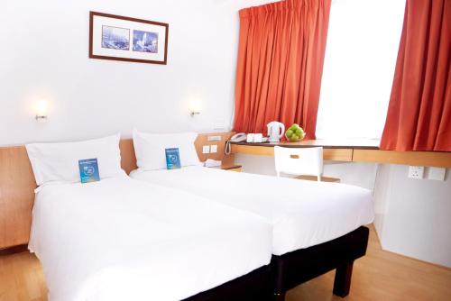 Habitación Doble Superior - 2 camas del hotel Ibis Hong Kong North Point. Foto 1