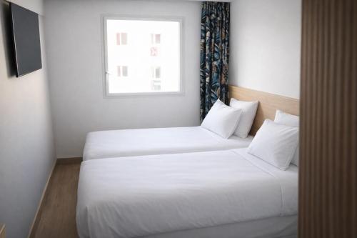 Dos Habitaciones Comfort Contiguas del hotel Geographotel Paris - Roissy Cdg Airport. Foto 3