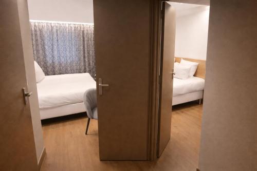 Dos Habitaciones Comfort Contiguas del hotel Geographotel Paris - Roissy Cdg Airport. Foto 4