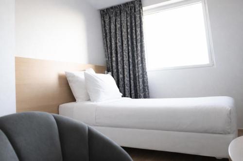 Habitación Individual Confort del hotel Geographotel Paris - Roissy Cdg Airport. Foto 3