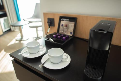 Habitación Doble Executive con sofá del hotel Novotel London Wembley. Foto 12