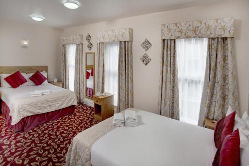 Habitación familiar - cama doble e individuales del hotel Best Western Greater London. Foto 2