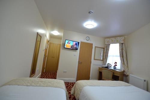 Habitación Familiar con 2 camas dobles del hotel Best Western Greater London. Foto 3