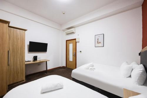 Habitación Doble Estándar - 2 camas del hotel Oyo Arinza , London Ilford. Foto 4