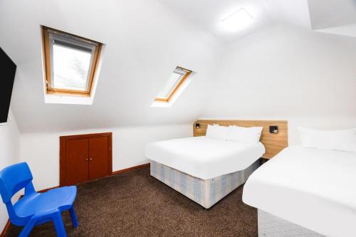Habitación Triple Deluxe del hotel Oyo Arinza , London Ilford. Foto 4