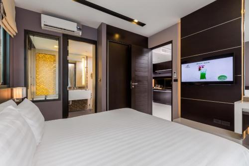 Suite Junior con acceso a la piscina del hotel The Charm Resort Phuket. Foto 2