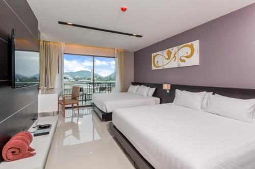 Suite Familiar de 1 dormitorio del hotel The Charm Resort Phuket. Foto 1