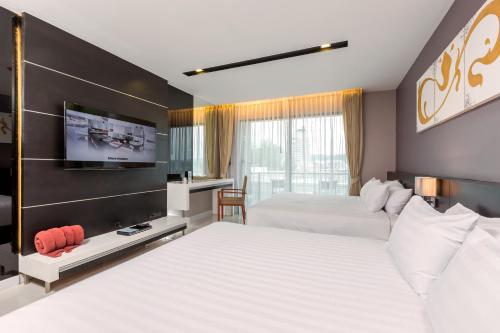 Suite Familiar de 1 dormitorio del hotel The Charm Resort Phuket. Foto 2
