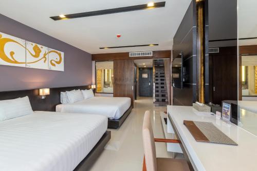 Suite Familiar de 1 dormitorio del hotel The Charm Resort Phuket. Foto 12
