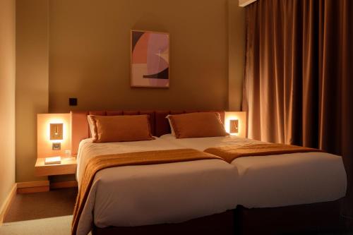 Habitación Triple del hotel Made Inn Entroncamento. Foto 1