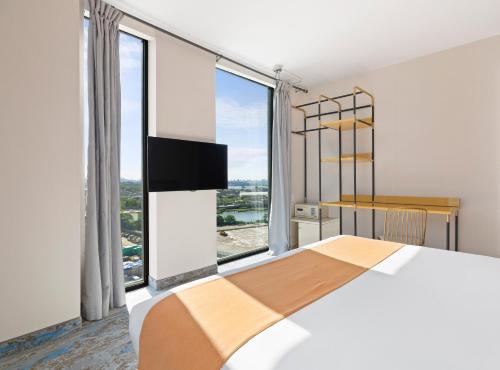 Habitación Deluxe adaptada para personas de movilidad reducida - 1 cama extragrande del hotel The Parc. Foto 1