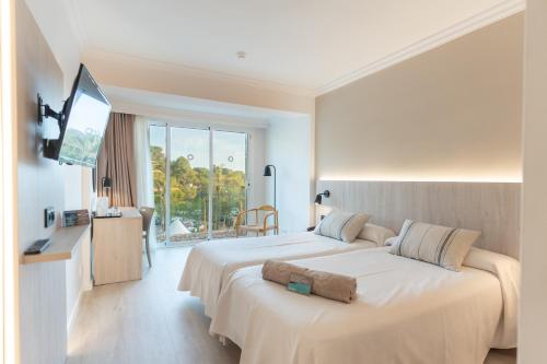 Habitación Doble con vistas frontales - 2 camas del hotel Minura Cala Galdana & Apartamentos d'Aljandar. Foto 4