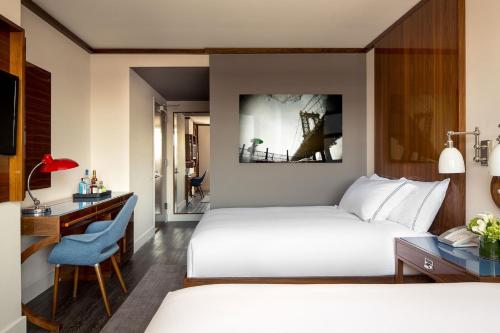 Habitación Cuádruple Deluxe del hotel Hugo. Foto 1