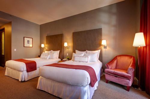 Habitación Cuádruple con balcón del hotel Hotel Giraffe. Foto 1