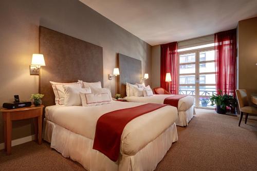 Habitación Cuádruple con balcón del hotel Hotel Giraffe. Foto 2