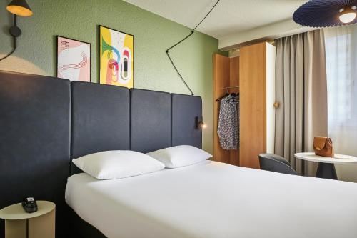 Dos habitaciones contiguas del hotel ibis Paris Avenue d'Italie 13ème. Foto 1