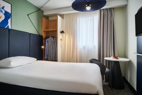 Dos habitaciones contiguas del hotel ibis Paris Avenue d'Italie 13ème. Foto 3
