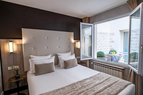 Habitación Doble con patio del hotel de la Paix. Foto 4