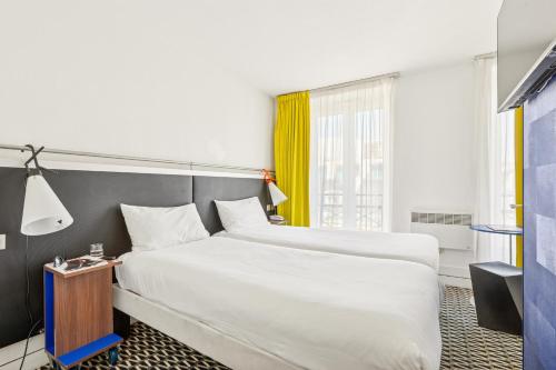Habitación Doble Estándar - 2 camas del hotel ibis Styles Paris République Le Marais. Foto 5