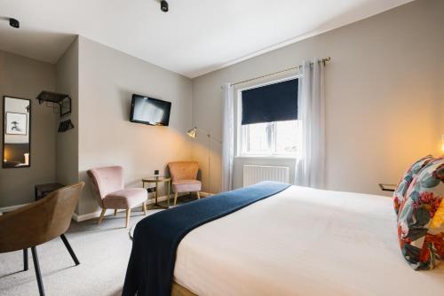 Habitación con cama extragrande. del hotel CitySpace Borough