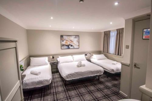 Habitación cuádruple del hotel Howard Winchester
