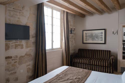 Habitación cuádruple del hotel Saint-Louis Marais. Foto 1