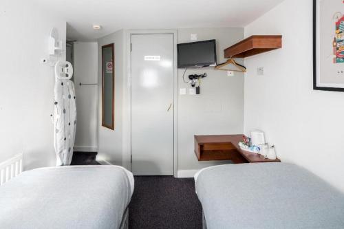 Habitación Doble Estándar - 2 camas del hotel Apollo Kings Cross. Foto 3