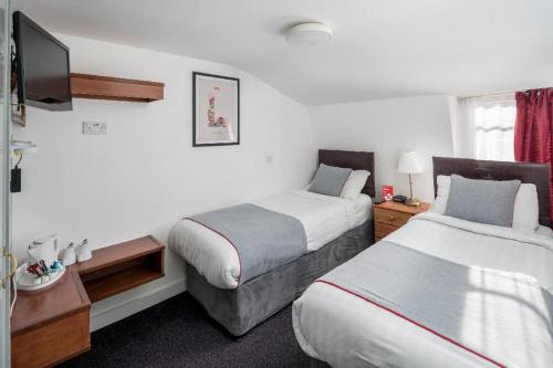 Habitación Doble Estándar - 2 camas del hotel Apollo Kings Cross. Foto 5