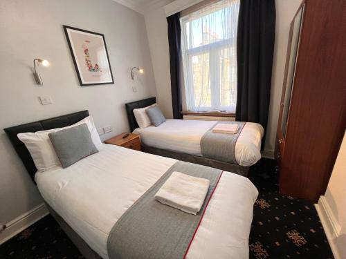Habitación Doble Estándar - 2 camas del hotel Apollo Kings Cross. Foto 9