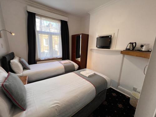 Habitación Doble Estándar - 2 camas del hotel Apollo Kings Cross. Foto 12