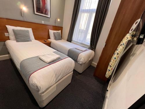 Habitación Doble Estándar - 2 camas del hotel Apollo Kings Cross. Foto 13